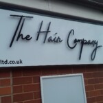 The Hair Company salon sign